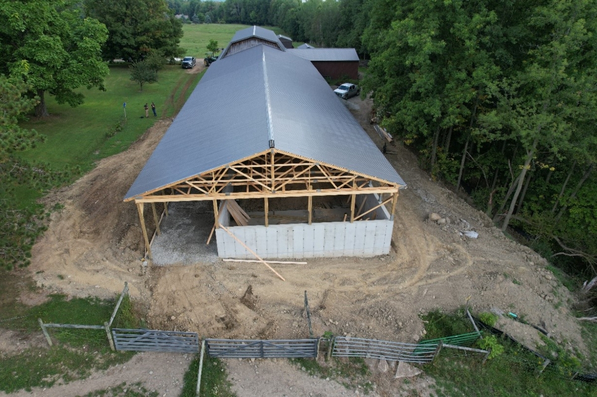 Roof construction for a covered waste storage system at Mekka Jo Farms
